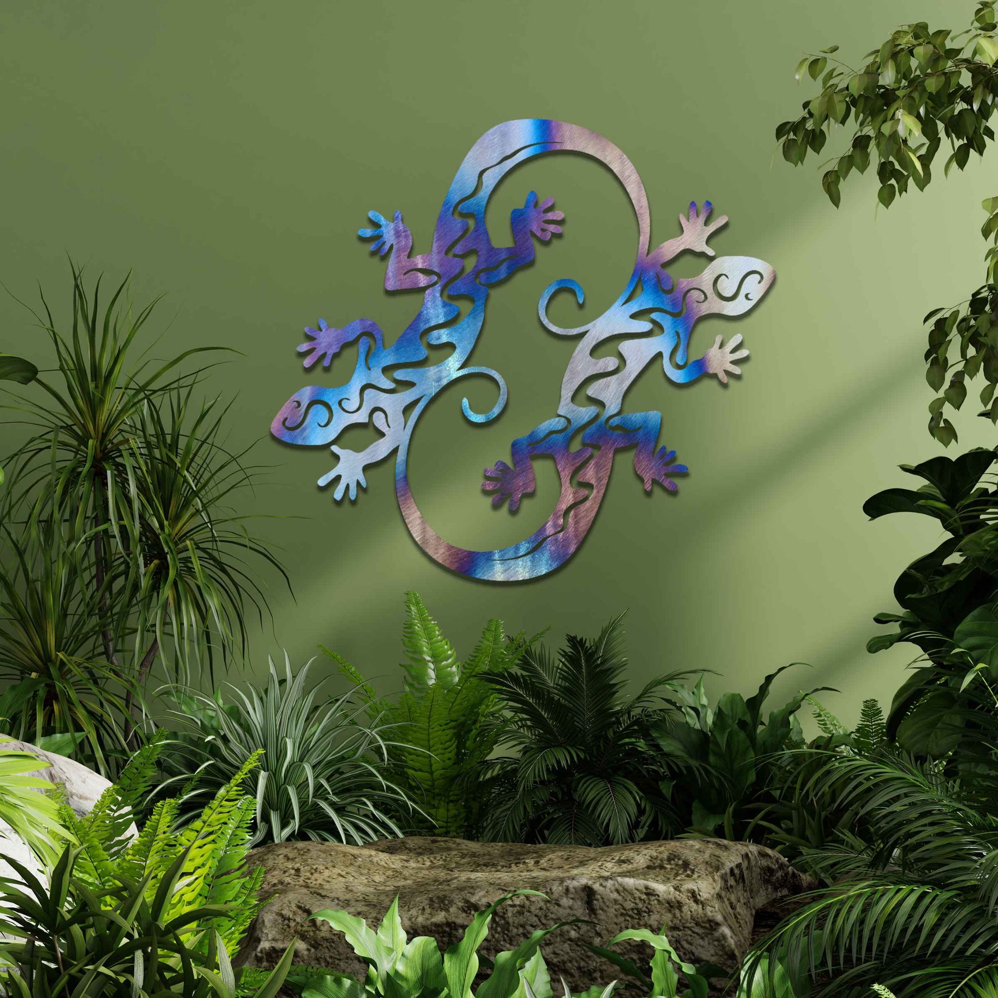 Metal wall decoration featuring two intertwined gecko designs with flowing and curved patterns, adding a dynamic and modern artistic touch to indoor spaces, displayed on a neutral wall within contemporary decor.