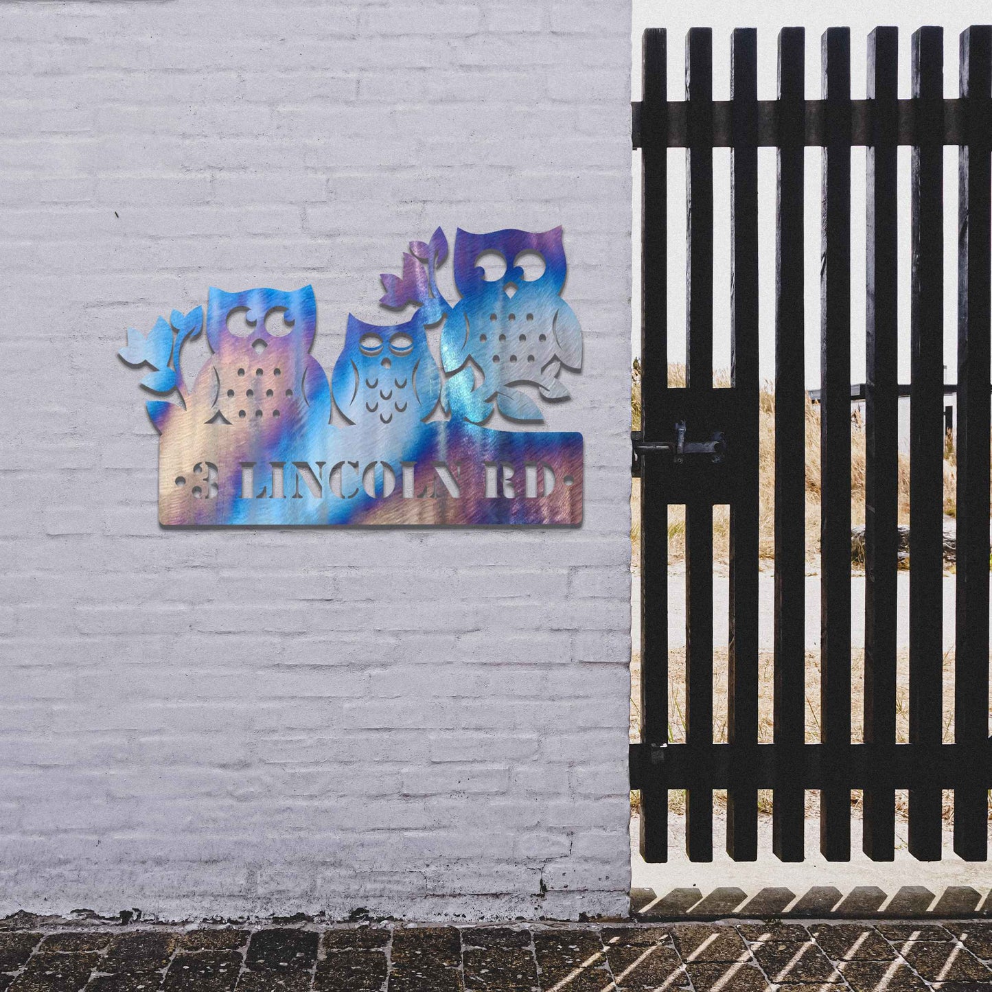Metal garden decoration featuring three owls perched on a "Welcome" sign with a rustic finish, combining playful charm and warmth to create an inviting accent for outdoor walls, porches, or entryways.