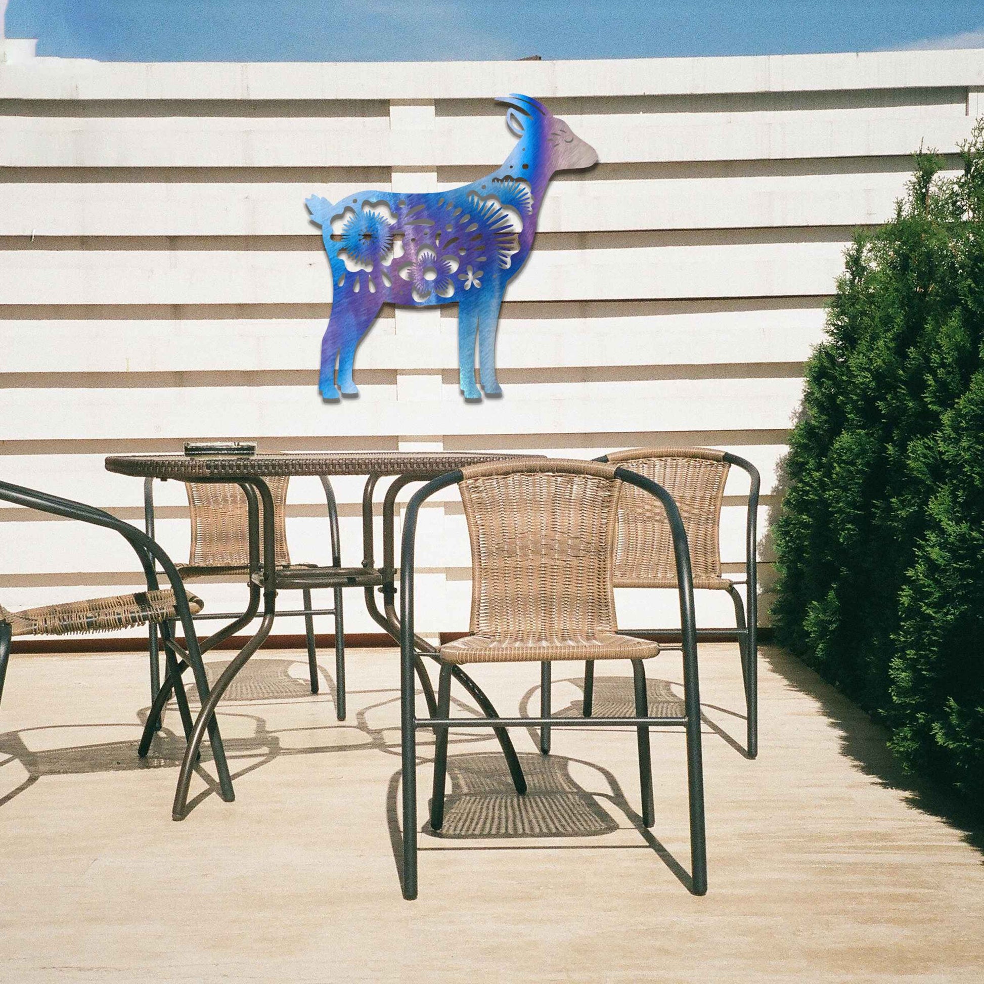 Side profile of a goat, beautifully adorned with intricate floral patterns along its body. The floral design enhances the natural grace of the animal, creating a charming and rustic piece of wall art.