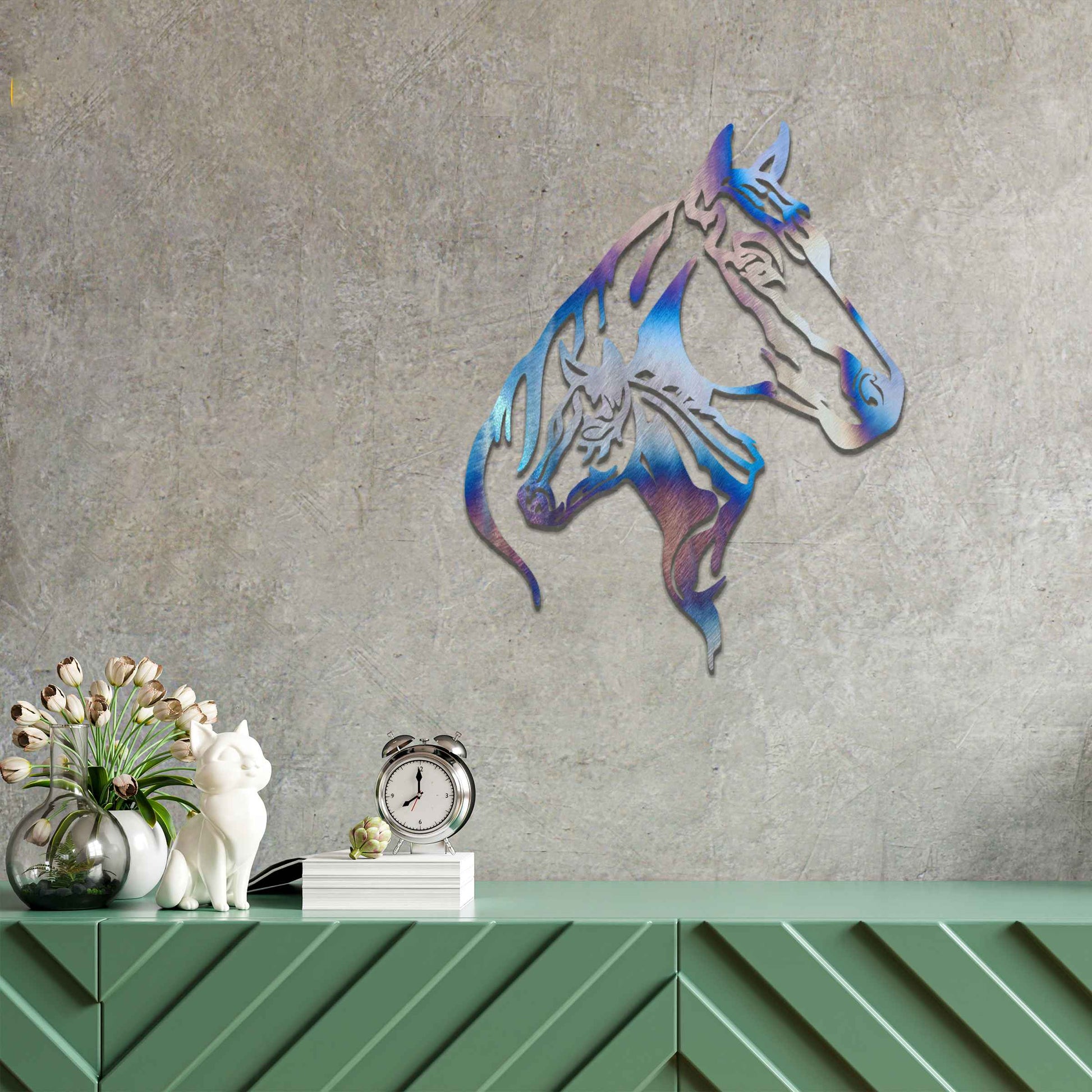 This metal wall art features two horse heads, one adult and one young, with elegant details showcasing their flowing manes and strong expressions. The design captures the connection and power of these majestic creatures.