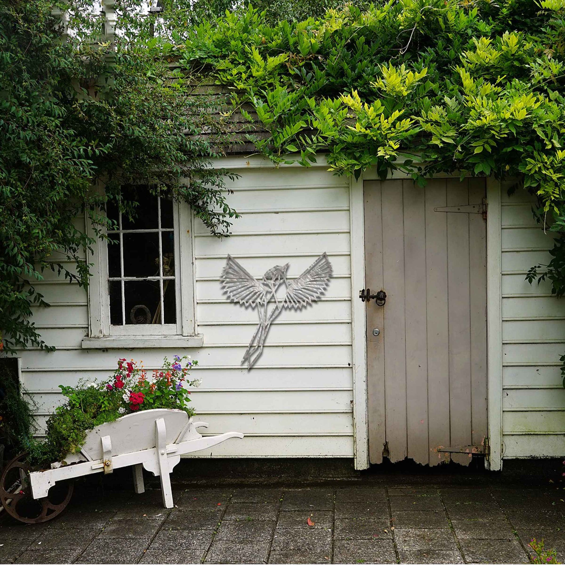 Metal garden decoration featuring a geometric bird design in flight, crafted with sharp, angular detailing for a modern and artistic touch, perfect for enhancing outdoor or indoor spaces with unique charm.