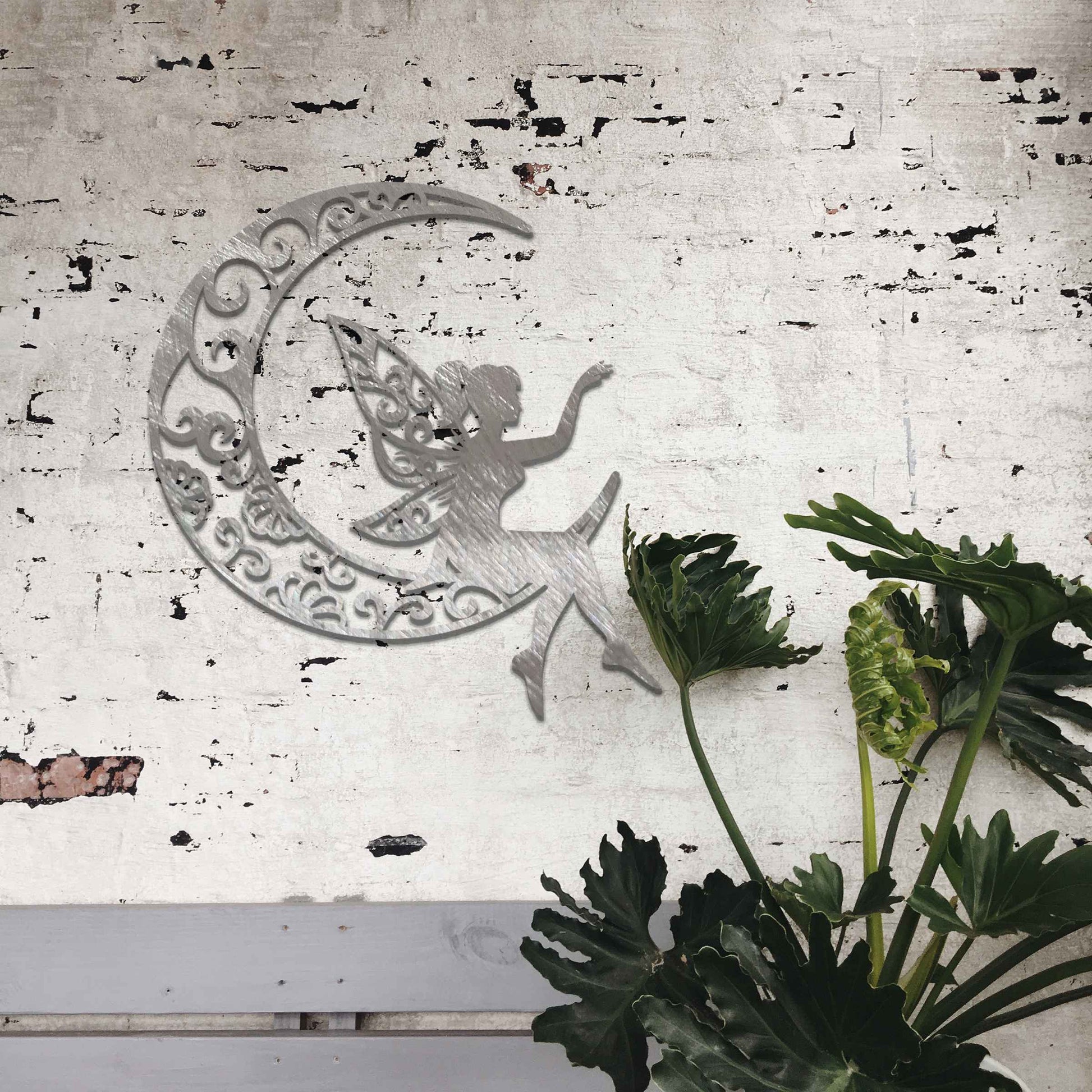 This artwork features a fairy gracefully seated on a crescent moon, her wings adorned with swirling floral patterns. The design captures a sense of peace and serenity, with the intricate details enhancing the enchanting nature of the scene.