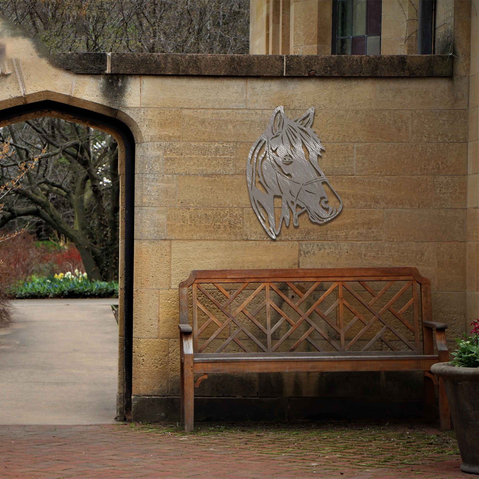 The design showcases the head of a horse in a minimalist style, highlighting its gentle expression and flowing mane. The silhouette captures the elegance and strength of the animal.