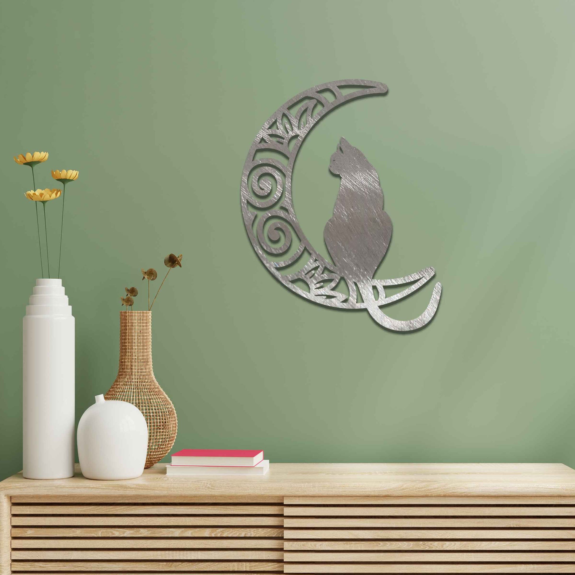 Metal garden decoration featuring a silhouette of a cat sitting on a crescent moon with intricate swirl and floral patterns, adding a mystical and elegant touch to outdoor or indoor walls.