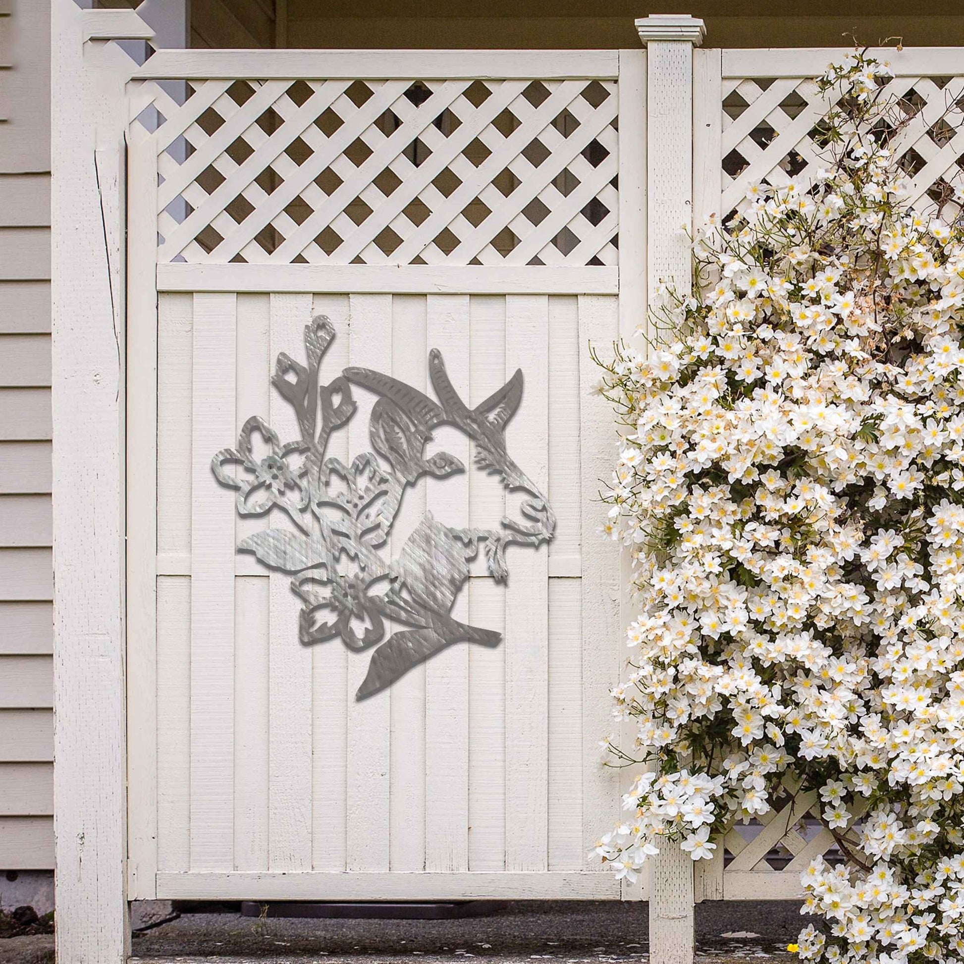 Goat head silhouette with delicate floral details integrated into the design. The artwork captures the goat’s profile surrounded by blooming flowers, creating a rustic, natural aesthetic for modern wall decor.