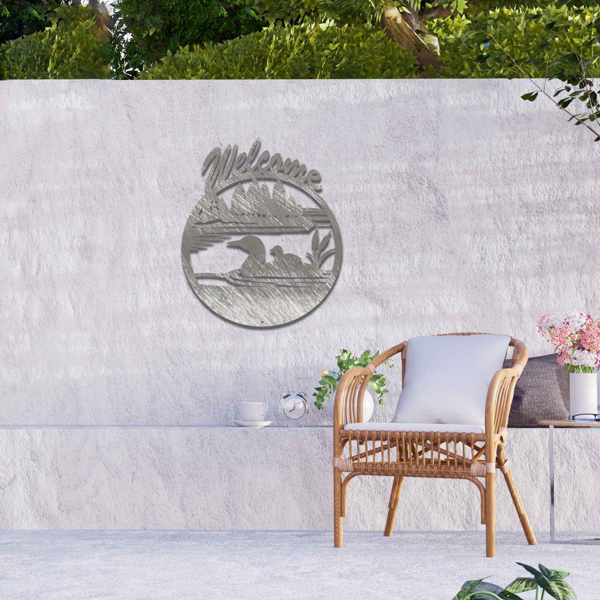 This design features two ducks in a water setting with the word "Welcome" above. The rustic finish adds charm, and the circular shape encapsulates the peaceful imagery, making it ideal for gardens or entrances.