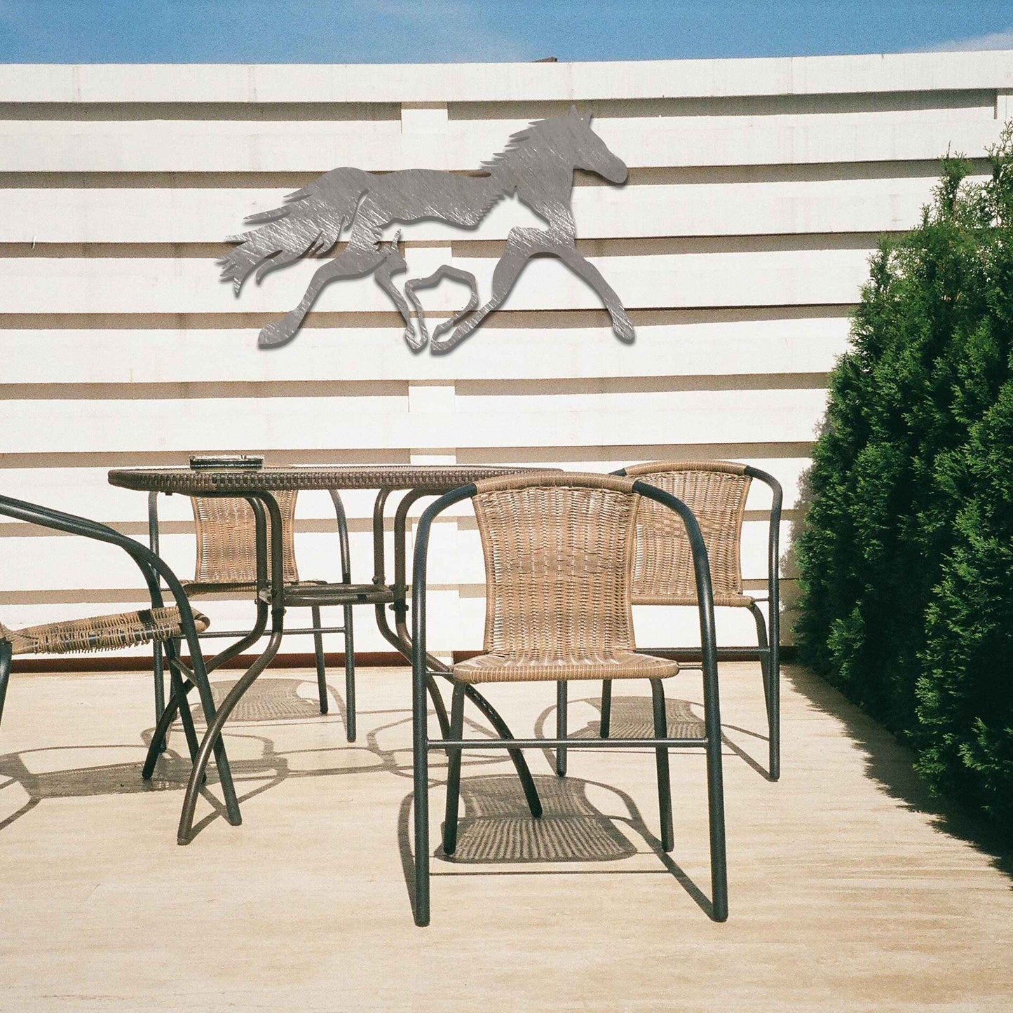 Metal wall art of a running horse, captured in motion with flowing mane and tail. The horse is designed with fluid lines, giving a dynamic impression of speed and energy.