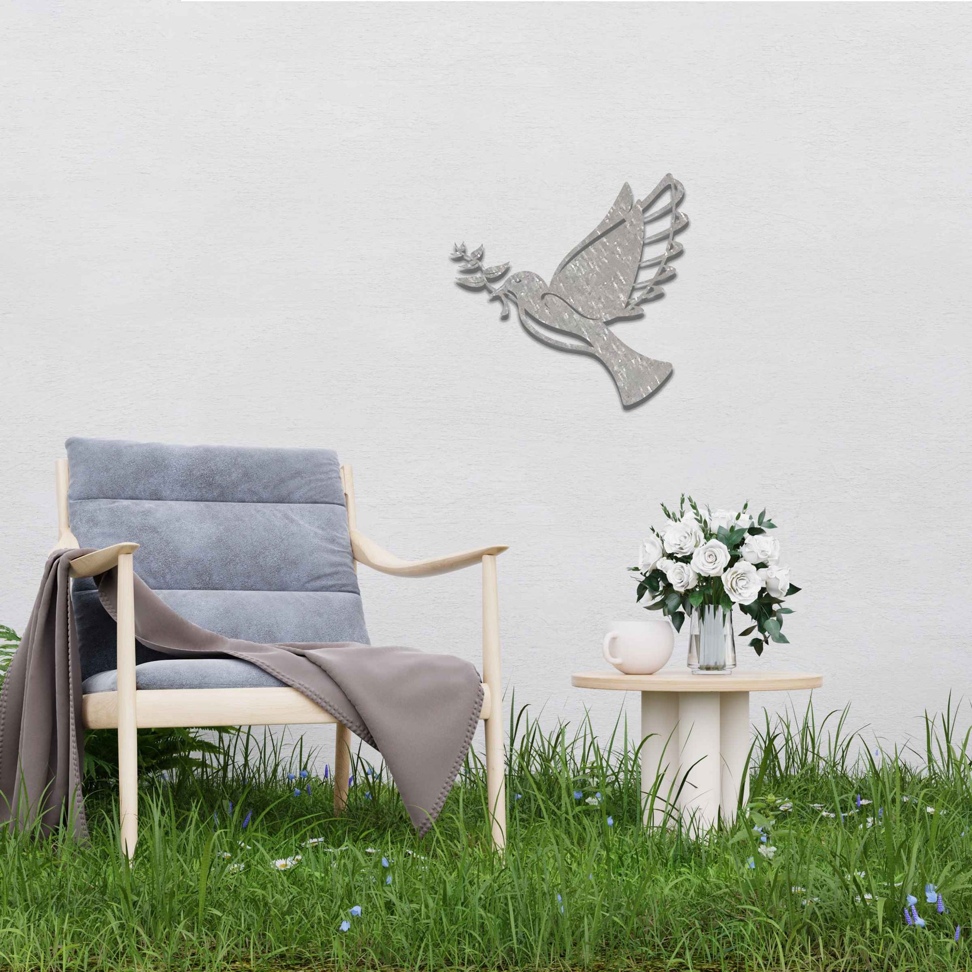 Metal garden decoration featuring a dove in flight holding an olive branch, crafted with a rustic finish, symbolising peace and harmony while adding a touch of elegance and meaning to outdoor spaces.