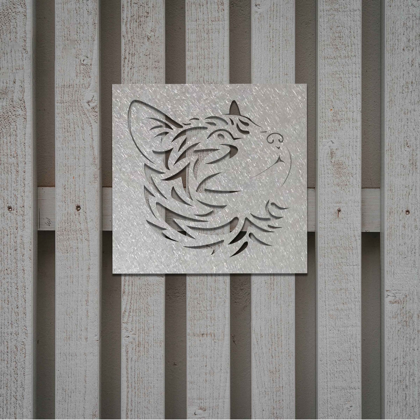This artwork features a captivating metal design of a cat's face with intricate cut-out details, perfect for a modern, minimalistic decor setting. The cat's profile is beautifully crafted, adding a touch of elegance to any space.
