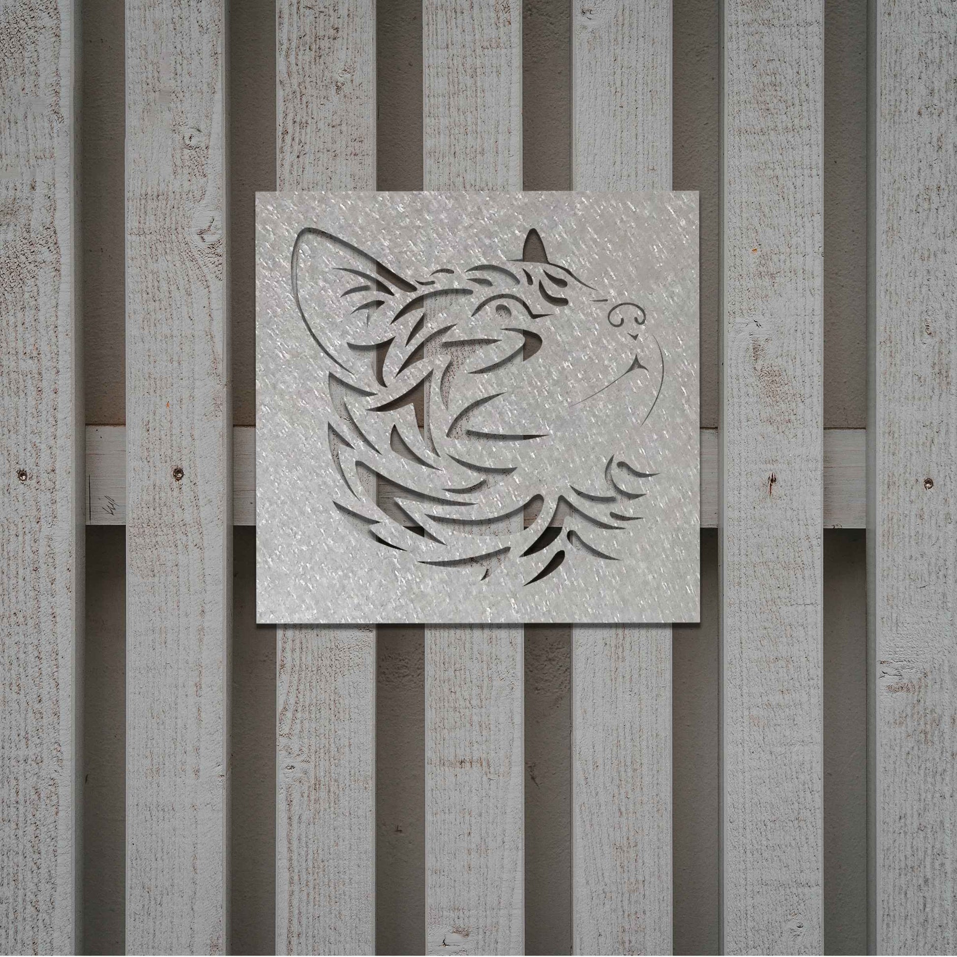 This artwork features a captivating metal design of a cat's face with intricate cut-out details, perfect for a modern, minimalistic decor setting. The cat's profile is beautifully crafted, adding a touch of elegance to any space.