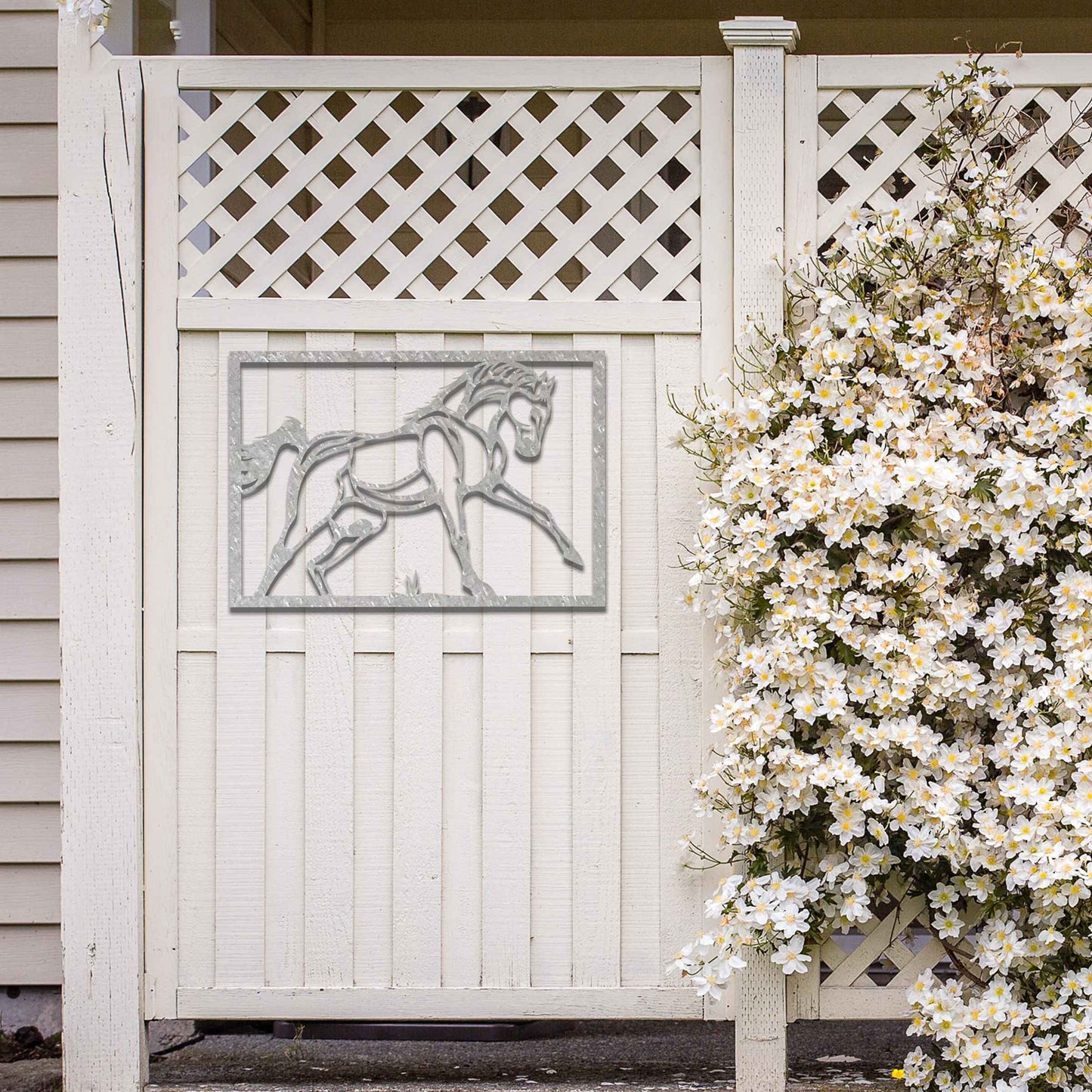 Metal wall art featuring an elegant horse in motion, outlined with bold lines and set within a rectangular frame. The artwork captures the graceful movement of the horse in a minimalistic style.