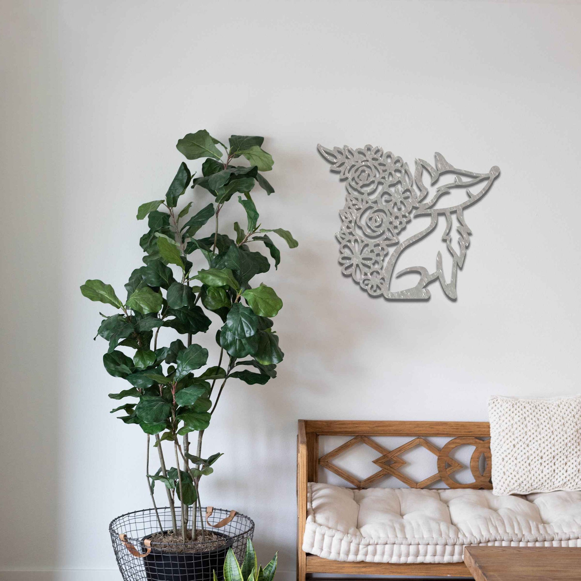 Metal wall decoration featuring a fox silhouette with a floral-patterned tail, crafted with intricate cutout details and a rustic finish, adding a whimsical and elegant touch to indoor or outdoor spaces.