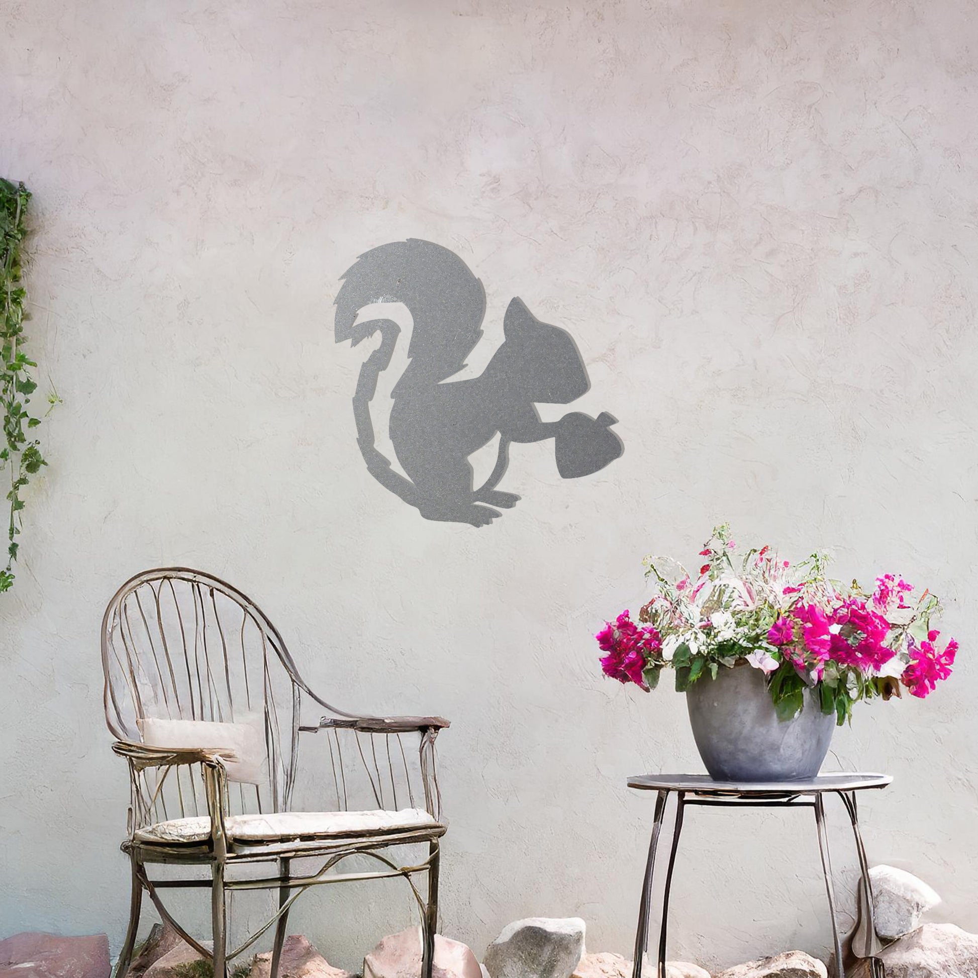 This design features a squirrel holding an acorn. The clean lines and intricate details of the animal's silhouette capture its playful and curious nature.