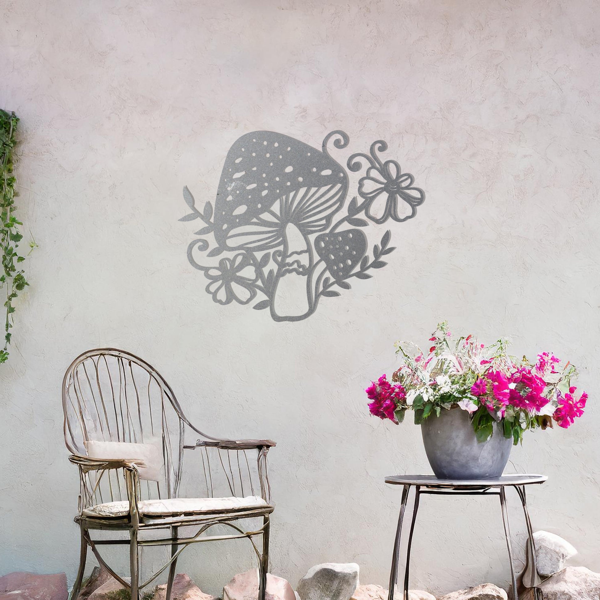 Metal garden decoration featuring a whimsical mushroom design surrounded by floral and leafy accents, intricately crafted to bring a touch of nature-inspired charm and artistry to outdoor spaces
