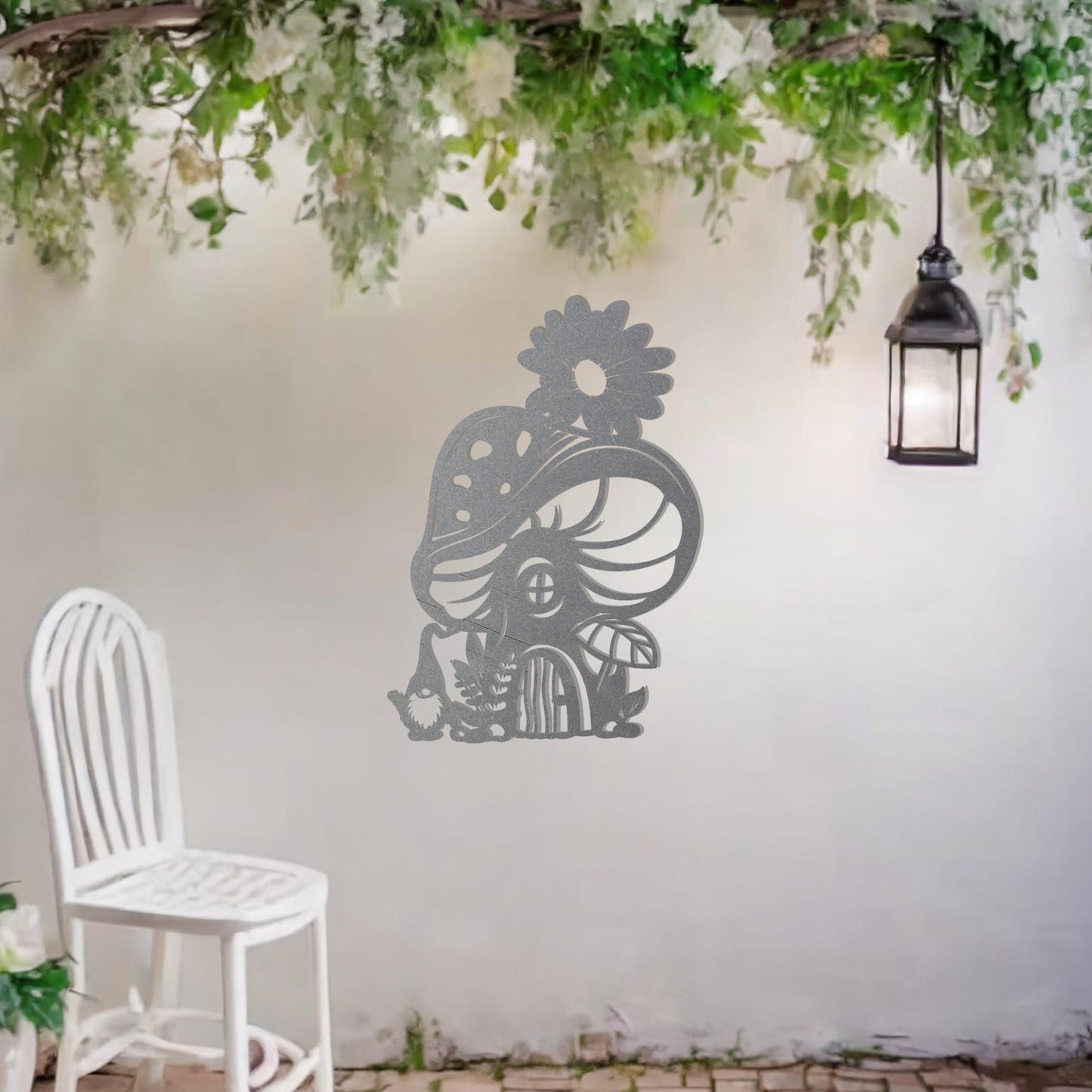Metal garden decoration featuring a whimsical mushroom house adorned with floral and foliage details, crafted with intricate patterns, adding an enchanting and playful touch to outdoor or indoor spaces.