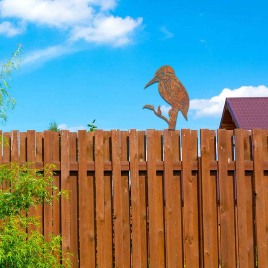 Metal garden decoration featuring a kingfisher silhouette perched on a branch, crafted with a rustic finish, designed to sit atop fences or garden posts, adding a natural and artistic accent to outdoor spaces.