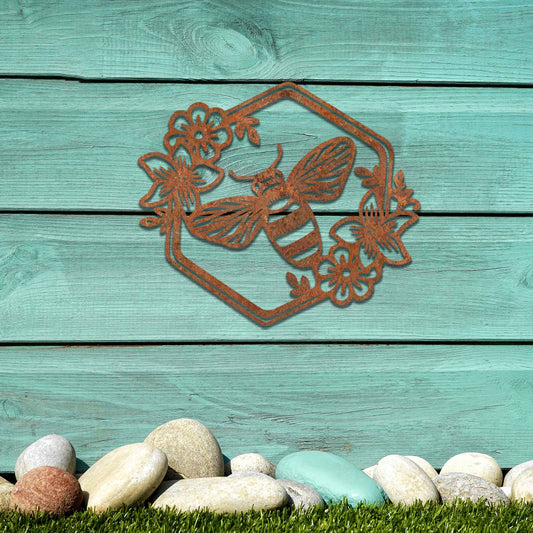 Metal garden decoration showcasing a bee design within a hexagonal frame, adorned with floral details, combining nature-inspired artistry and durability to enhance outdoor spaces with elegance and charm.