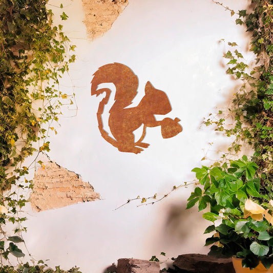 This design features a squirrel holding an acorn. The clean lines and intricate details of the animal's silhouette capture its playful and curious nature.