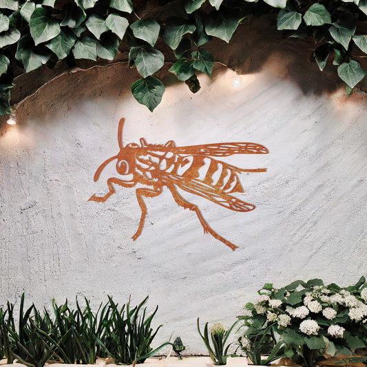 The design features a highly detailed wasp in mid-flight, showcasing intricate lines and patterns on its body and wings. The artwork is displayed above a tranquil water feature, highlighting the insect’s dynamic form.