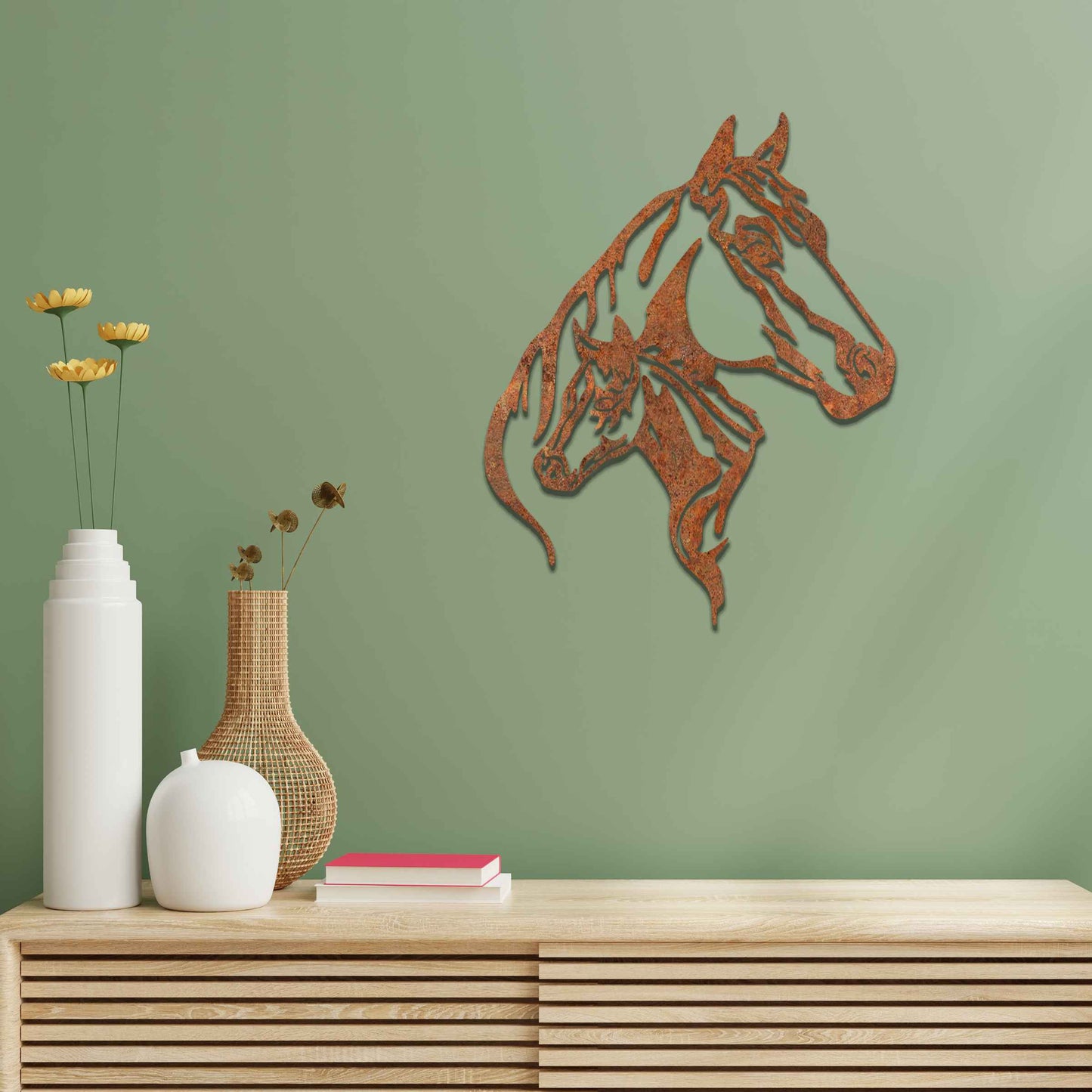 This metal wall art features two horse heads, one adult and one young, with elegant details showcasing their flowing manes and strong expressions. The design captures the connection and power of these majestic creatures.