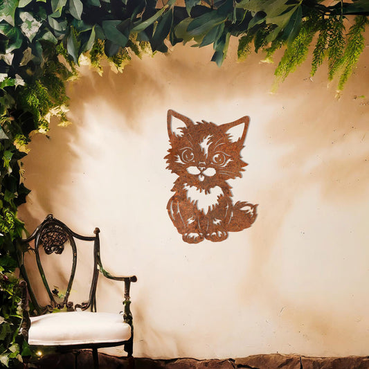 This design features an adorable kitten sitting upright with expressive eyes and playful details. The intricate lines bring charm and personality to this piece, making it a delightful decorative addition for animal lovers.