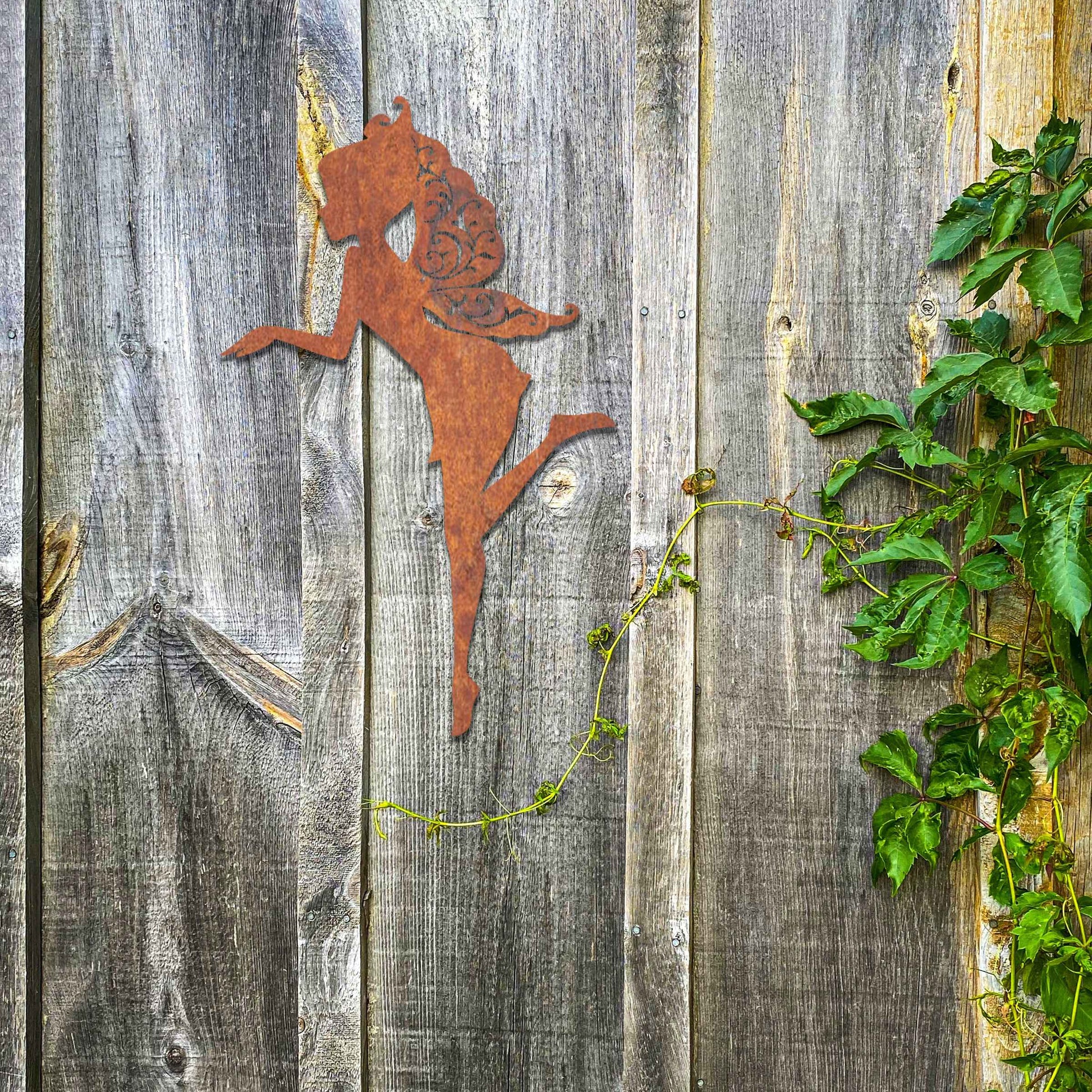 Thank you for the clarification! The design features a silhouette of a fairy in a graceful pose, with flowing hair and wings. The fairy is captured in mid-motion, bringing a sense of whimsy and elegance to the artwork.
