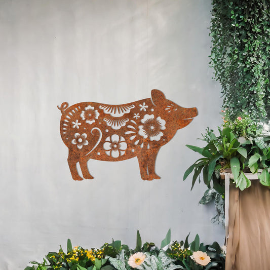 This design features a charming pig silhouette adorned with delicate floral patterns and intricate decorative details. The whimsical style of the artwork makes it a delightful addition to spaces looking for a playful yet artistic element. Perfect for rustic or countryside-inspired settings.