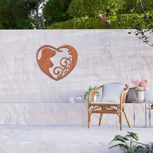 Metal garden decoration featuring a heart-shaped design with silhouettes of a dog and cat intertwined with elegant scrollwork, symbolising love for pets and adding a decorative charm to outdoor walls or garden spaces.