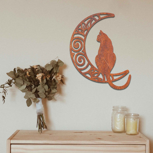 Metal garden decoration featuring a silhouette of a cat sitting on a crescent moon with intricate swirl and floral patterns, adding a mystical and elegant touch to outdoor or indoor walls.