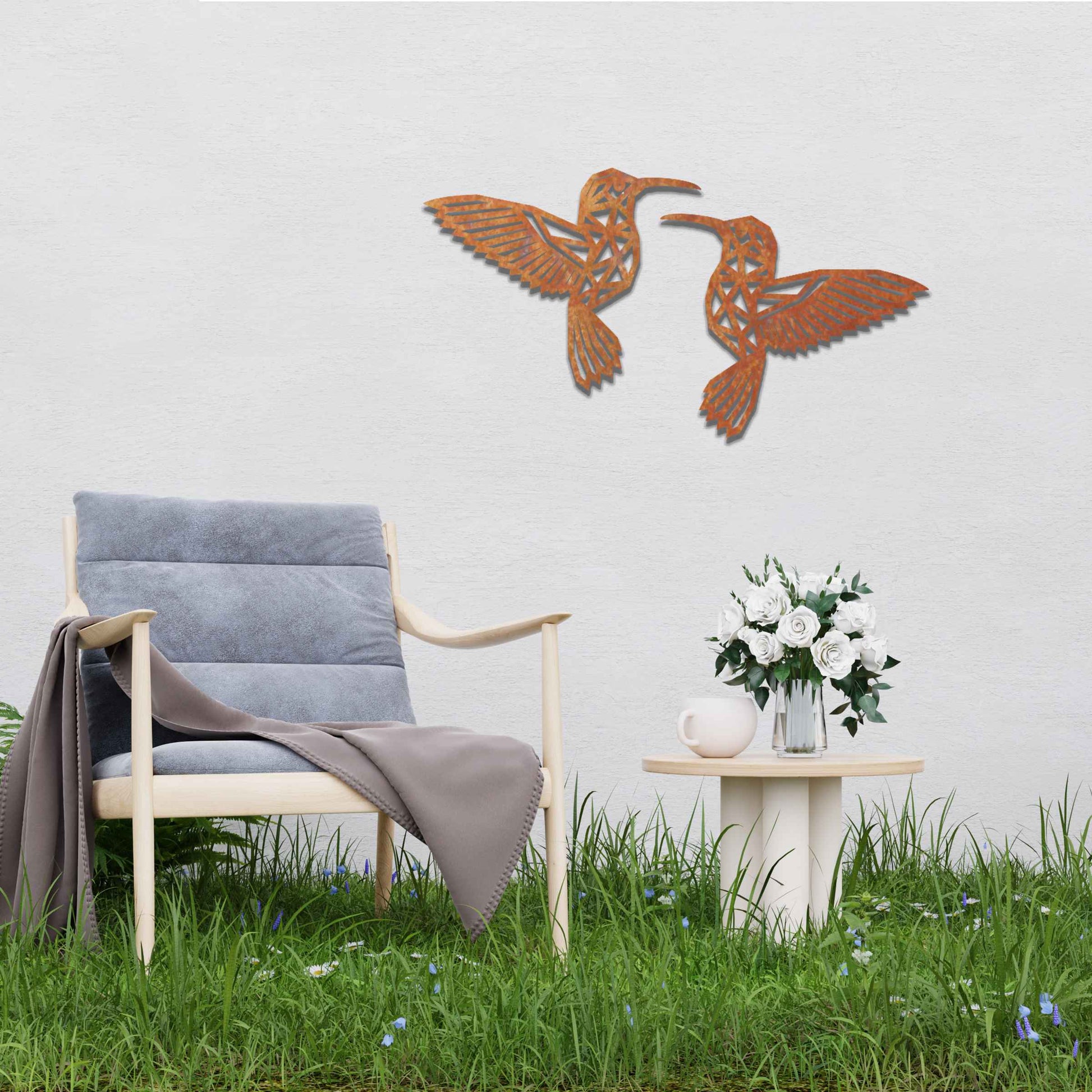 Metal garden decoration featuring two hummingbirds with geometric patterns in a dynamic pose, intricately designed to add elegance and a nature-inspired artistic touch to outdoor walls, fences, or garden sheds