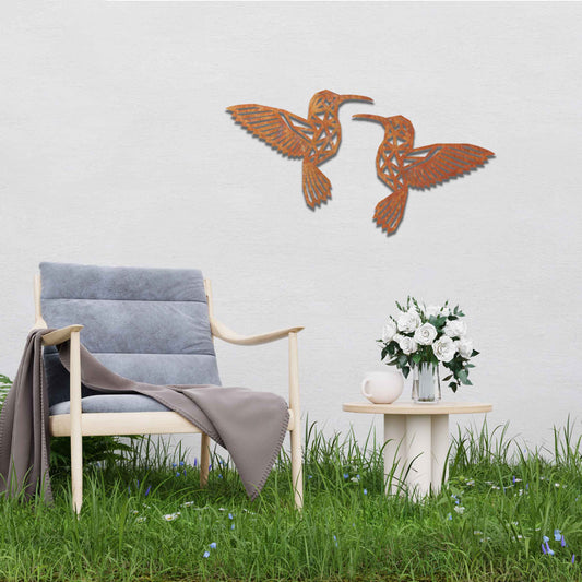 Metal garden decoration featuring two hummingbirds with geometric patterns in a dynamic pose, intricately designed to add elegance and a nature-inspired artistic touch to outdoor walls, fences, or garden sheds
