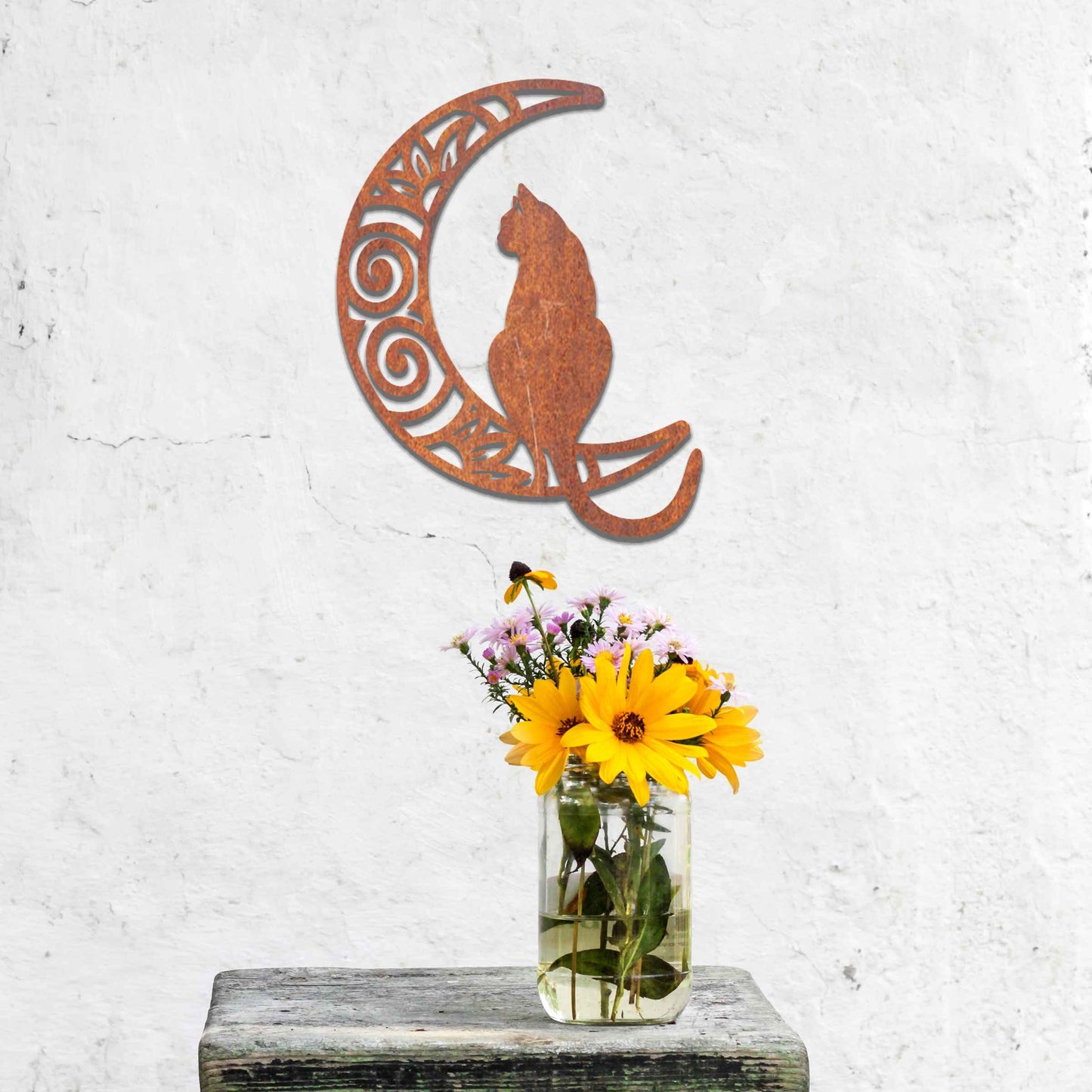Metal garden decoration featuring a silhouette of a cat sitting on a crescent moon with intricate swirl and floral patterns, adding a mystical and elegant touch to outdoor or indoor walls.