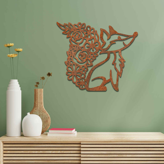 Metal wall decoration featuring a fox silhouette with a floral-patterned tail, crafted with intricate cutout details and a rustic finish, adding a whimsical and elegant touch to indoor or outdoor spaces.