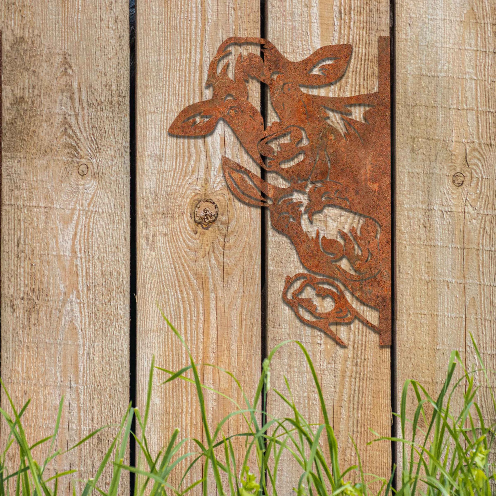 Metal decoration featuring a cow, a donkey, and a goose peeking around a vertical edge, crafted with intricate cutout details and a rustic finish, adding a whimsical and rustic charm to outdoor or garden spaces.