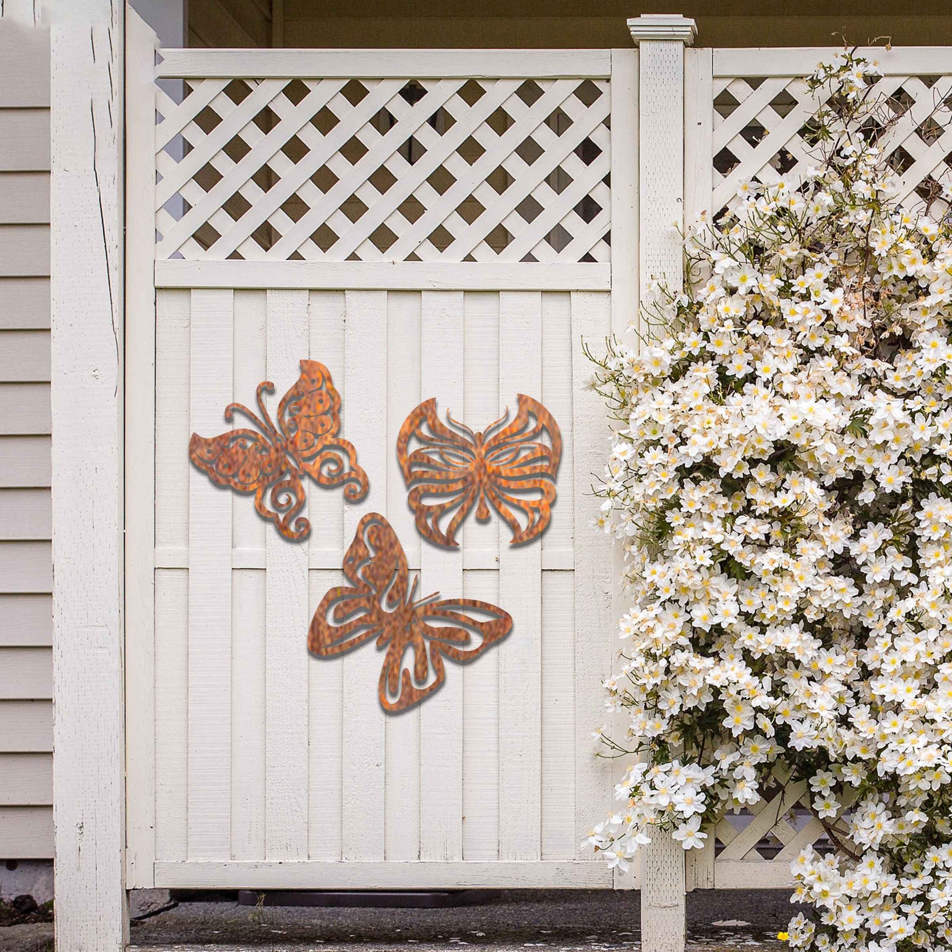 Set of metal garden decorations featuring three distinct butterfly designs with intricate patterns, adding a playful and nature-inspired charm to outdoor walls, fences, or garden spaces