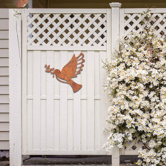 Metal garden decoration featuring a dove in flight holding an olive branch, crafted with a rustic finish, symbolising peace and harmony while adding a touch of elegance and meaning to outdoor spaces.