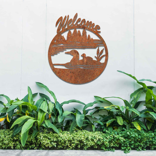 This design features two ducks in a water setting with the word "Welcome" above. The rustic finish adds charm, and the circular shape encapsulates the peaceful imagery, making it ideal for gardens or entrances.