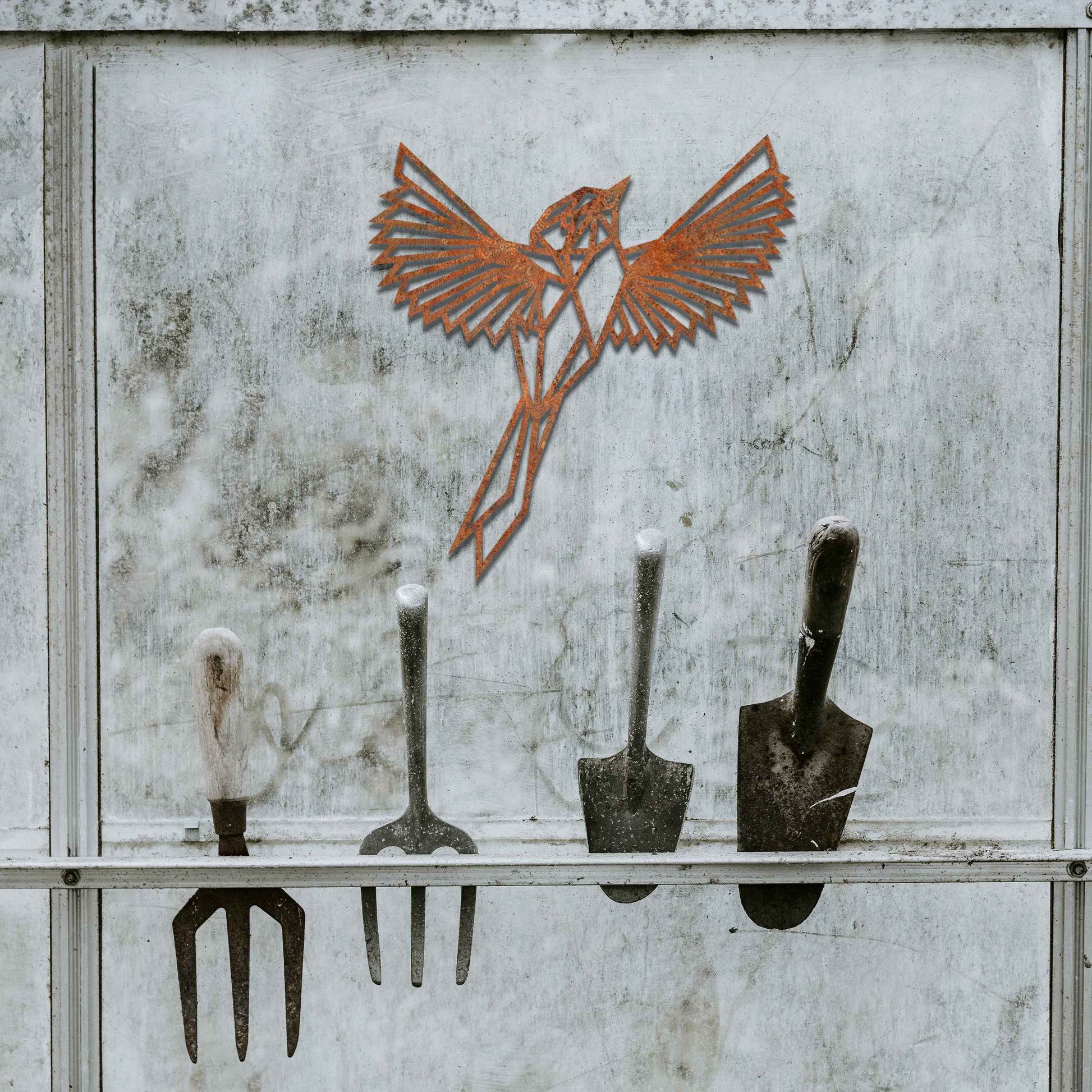 Metal garden decoration featuring a geometric bird design in flight, crafted with sharp, angular detailing for a modern and artistic touch, perfect for enhancing outdoor or indoor spaces with unique charm.