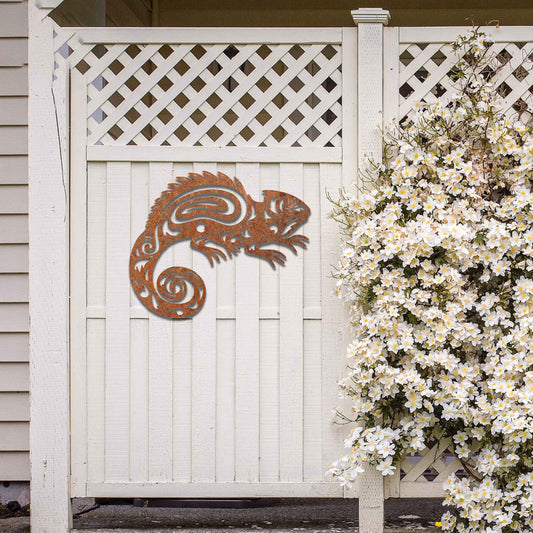 Metal wall decoration featuring a chameleon design with intricate tribal-inspired cutouts, adding an exotic and artistic touch to indoor spaces, displayed on a neutral wall in modern decor.