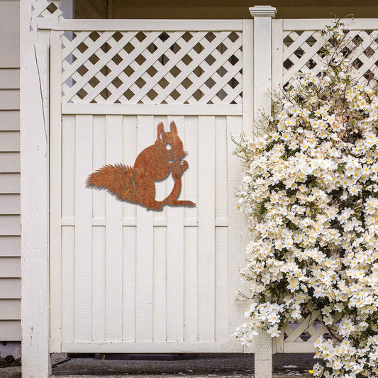Metal wall decoration featuring a squirrel design with intricate details, adding a playful and artistic touch to indoor spaces, displayed on a neutral wall to highlight its elegant craftsmanship.