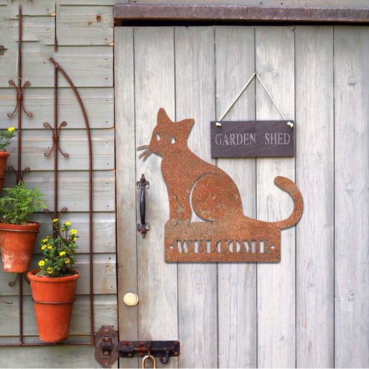 Metal garden decoration featuring a sleek sitting cat silhouette with a personalised address plaque, combining practicality with artistic charm for outdoor walls, fences, or gates.