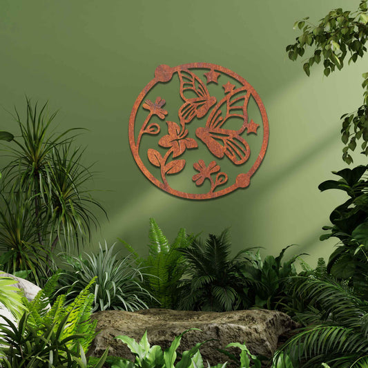 Metal garden decoration featuring a circular design with butterflies, flowers, and stars, crafted with a rustic finish, adding a whimsical and nature-inspired charm to outdoor walls or fences.