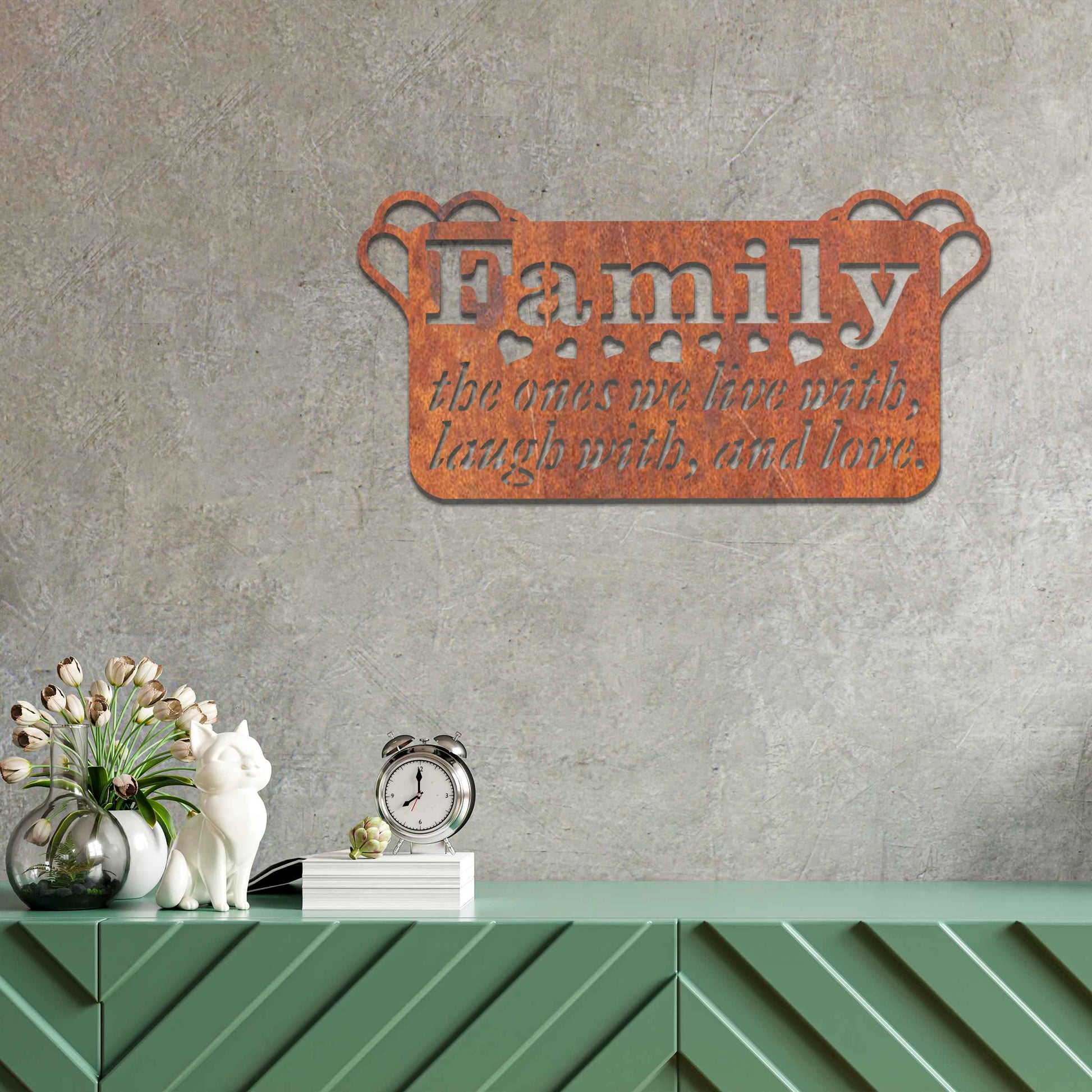 Metal wall decoration featuring the word "Family" and the phrase "the ones we live with, laugh with, and love," accented with heart details, adding a heartfelt and meaningful touch to indoor or outdoor spaces.