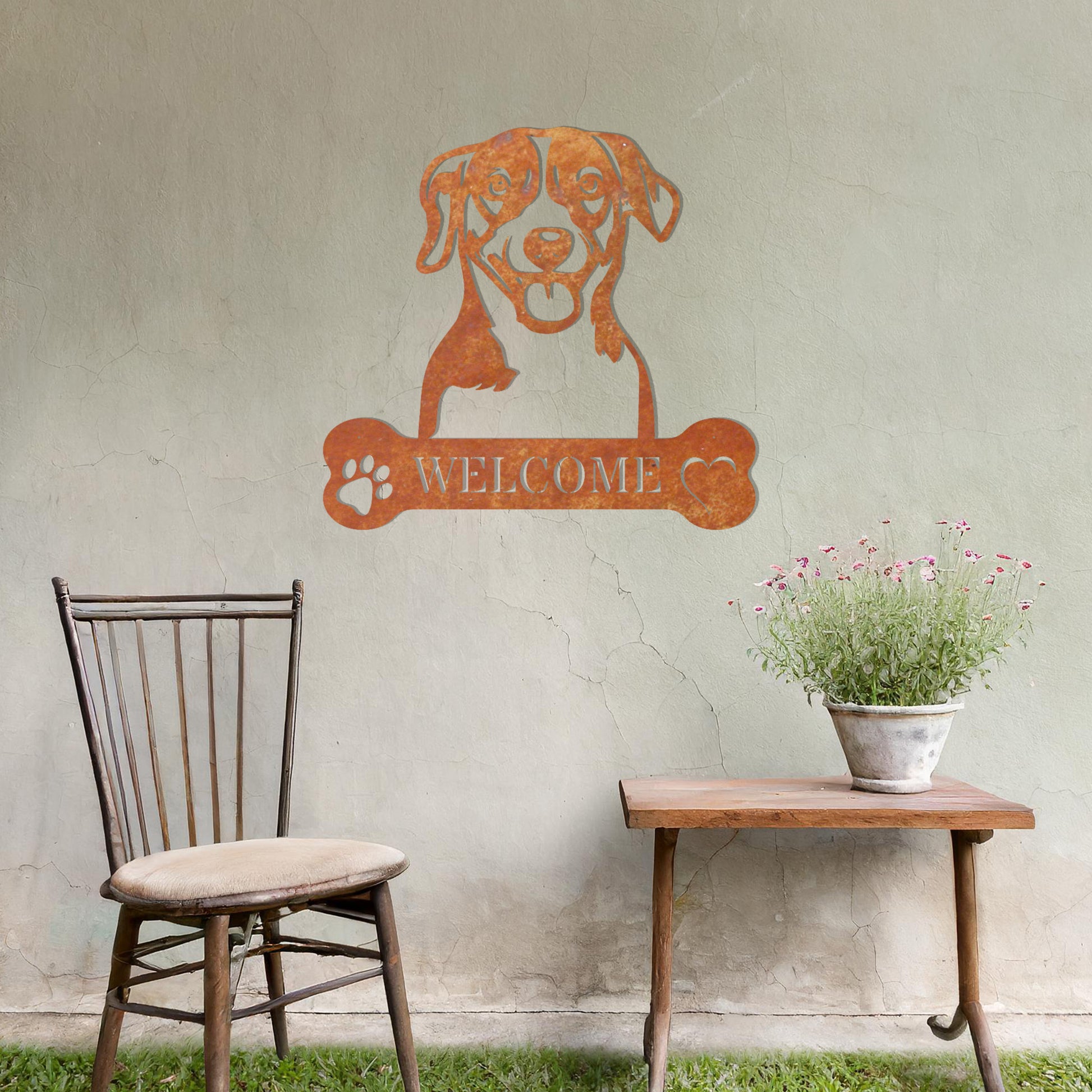 Metal Jack Russell Terrier dog design with a bone-shaped 'WELCOME' text and paw prints, perfect for adding a cheerful, welcoming touch to entryways or outdoor spaces.