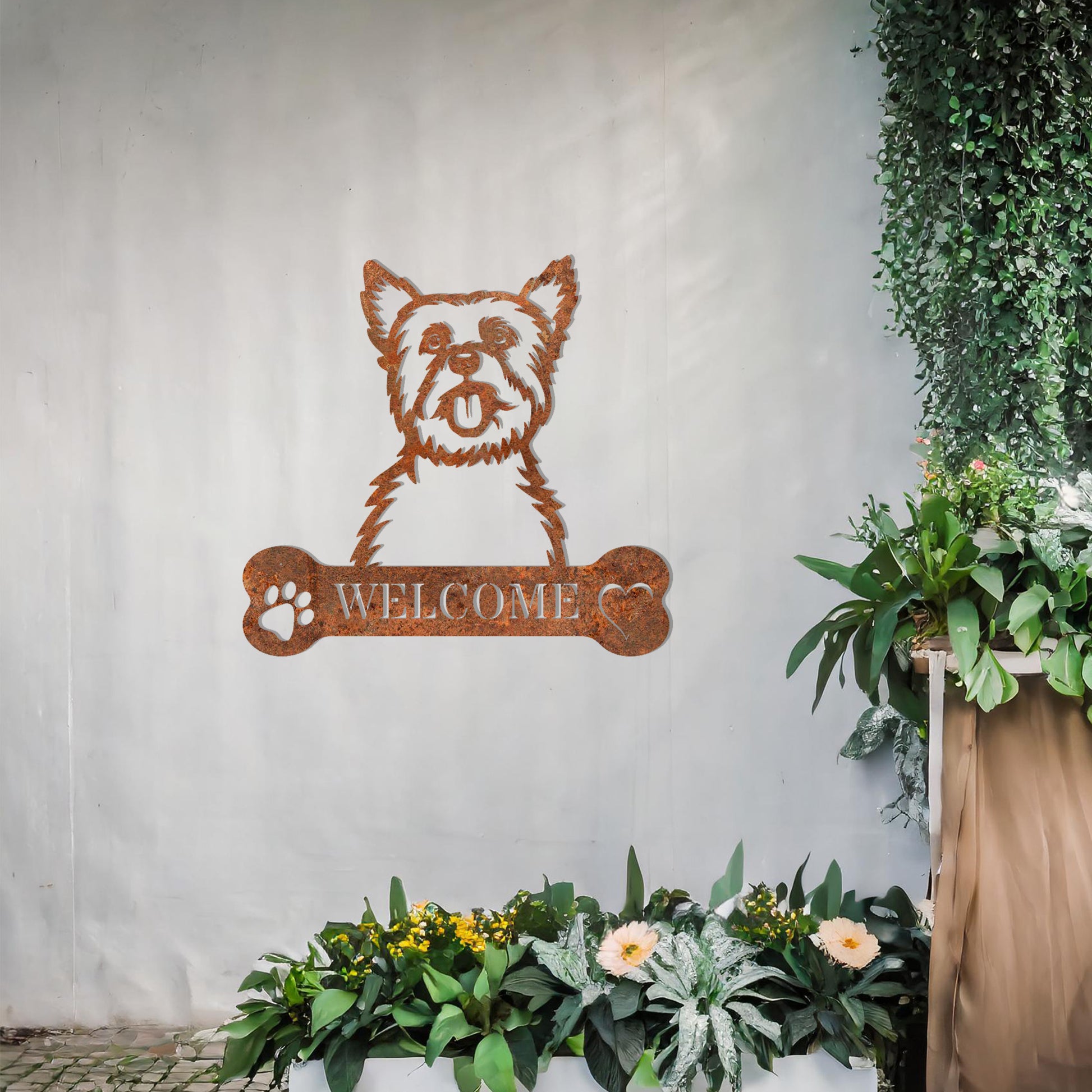 Metal Yorkshire Terrier dog design with a bone-shaped 'WELCOME' text and paw prints, perfect for adding a cheerful and welcoming touch to entryways or outdoor spaces.