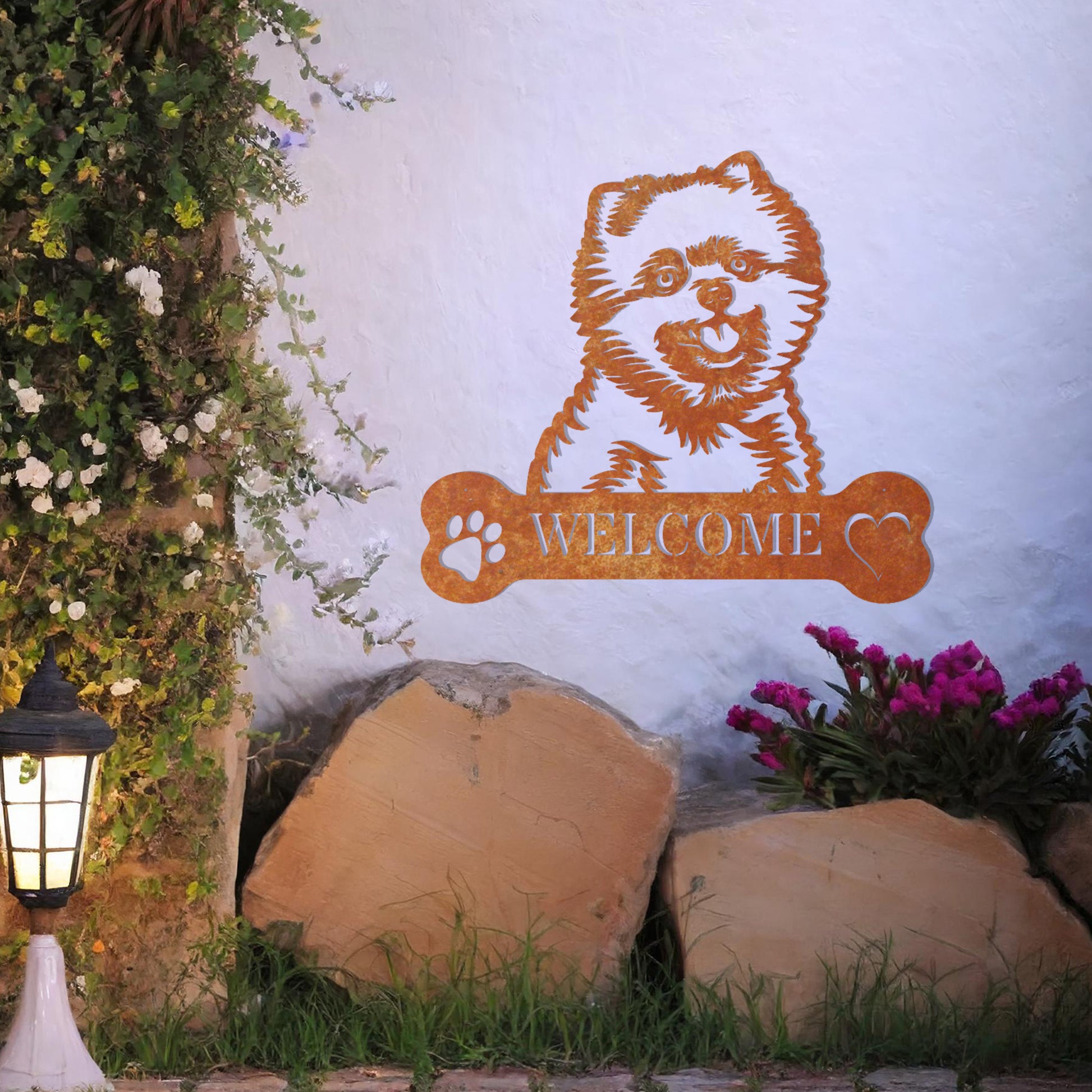 Metal Pomeranian dog design with a bone-shaped 'WELCOME' text and paw prints, perfect for adding a friendly and welcoming touch to entryways or outdoor spaces.
