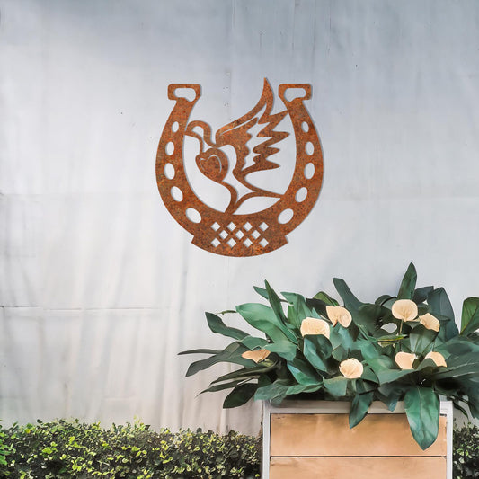 This wall art features a horseshoe design with a dove in flight carrying a heart at its center, symbolising peace and luck. A meaningful and stylish addition to any space with its intricate details and balanced composition.