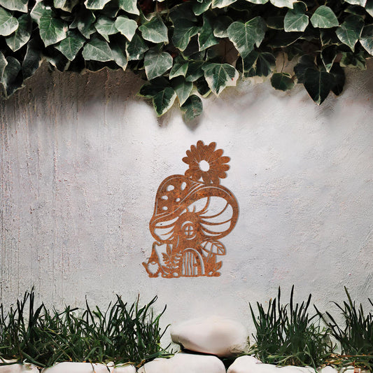 Metal garden decoration featuring a whimsical mushroom house adorned with floral and foliage details, crafted with intricate patterns, adding an enchanting and playful touch to outdoor or indoor spaces.