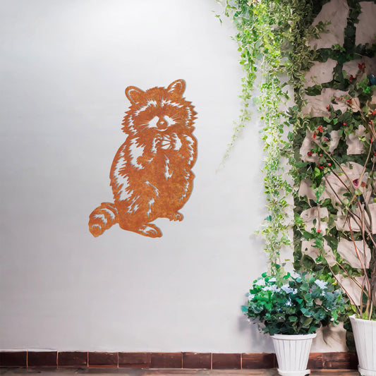 A metal wall art piece featuring a detailed raccoon design, evoking charm and playfulness. This adorable artwork adds a whimsical touch to modern or rustic settings, harmonising beautifully with natural decor elements.
