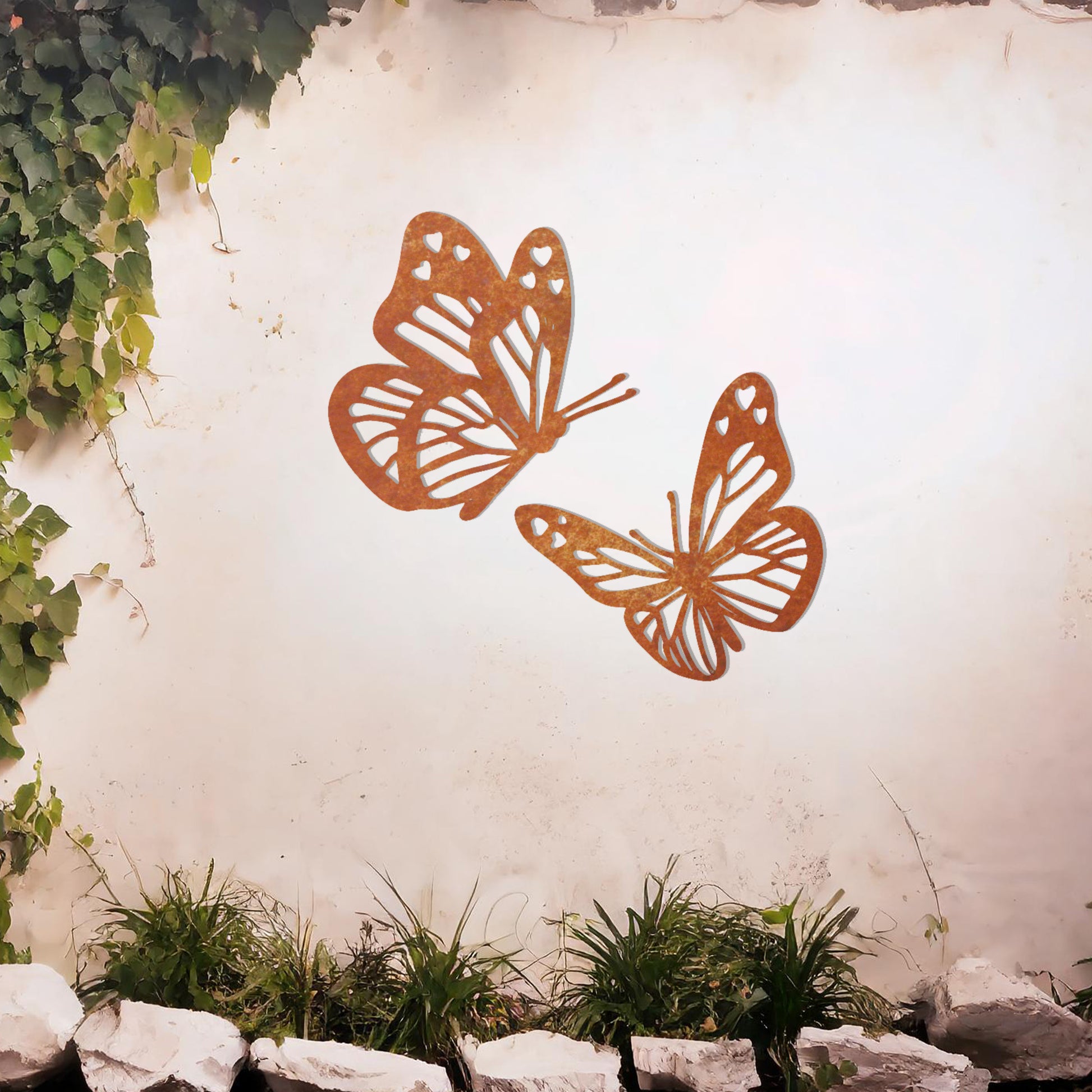 This design showcases a pair of intricately detailed butterflies in flight, their delicate wings adorned with heart-shaped accents. A charming addition to any space, celebrating the beauty of nature and the grace of butterflies.
